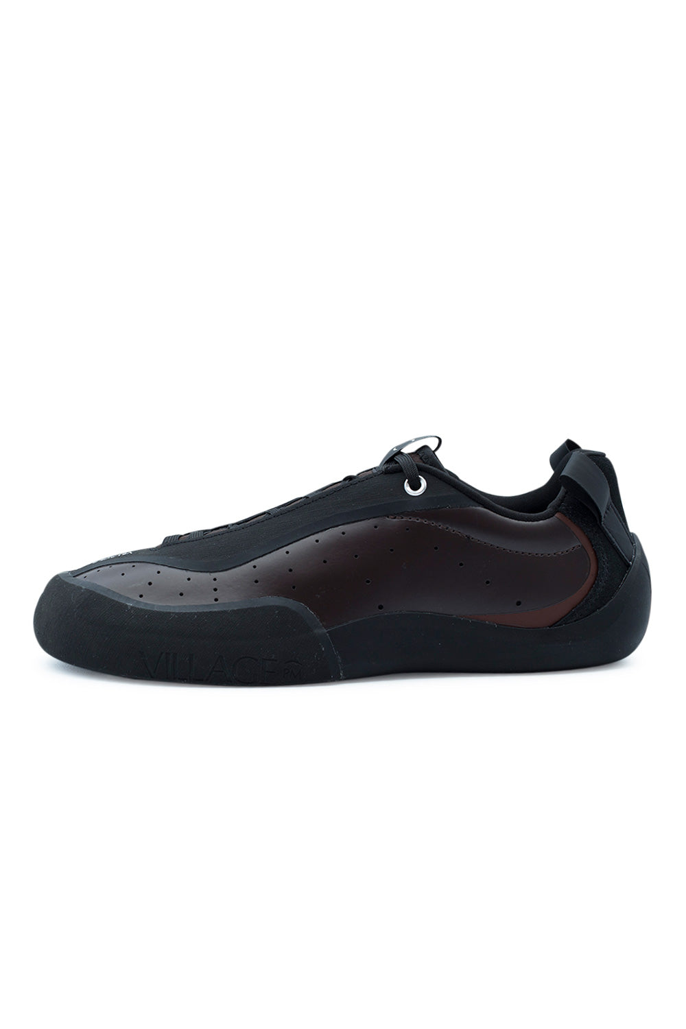 Lateral profile view of the Village PM 2PM skate shoe in Maroon and Natural Black, featuring a smooth perforated dark maroon synthetic leather upper, integrated black rubber lace-shield eyestay overlay, silver top eyelet, oversized black heel pull tab, and a hand-wrapped black sticky climbing rubber rand curving over the ollie friction zone and embossed with subtle "VILLAGE" branding.