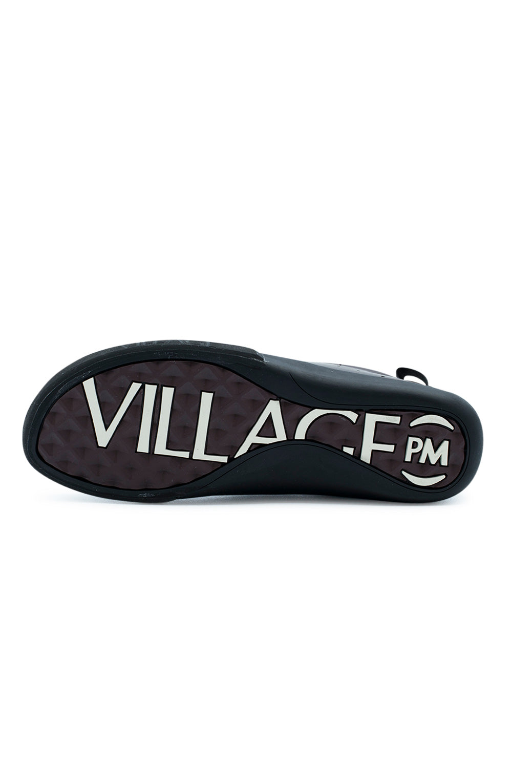 Full bottom perspective of the rubber outsole on the Village PM 2PM, featuring dark maroon diamond-lug traction tread stamped with high-contrast, oversized white "VILLAGE PM" typography beneath the arch and framed by the textured black rubber perimeter rand.