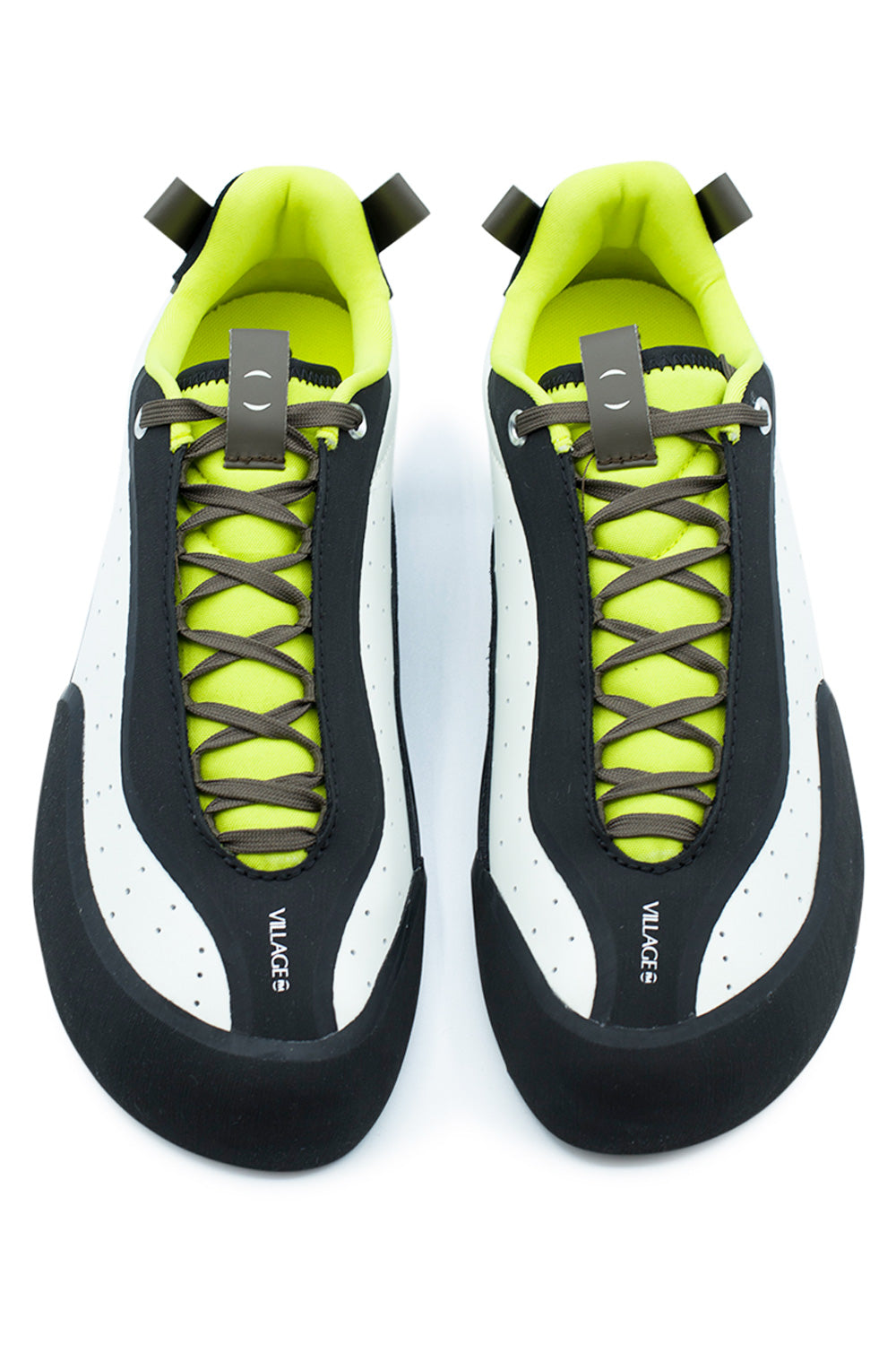 Top-down studio shot of a pair of Village PM 2PM White / Lime skate shoes, showcasing the anatomical asymmetrical silhouette with an angular toe box, protective matte black climbing rubber toe caps, extended olive laces recessed under protective rubber eyestay rands, vibrant neon lime mesh tongues, and branded tongue pull tabs printed with white "VILLAGE" logos.