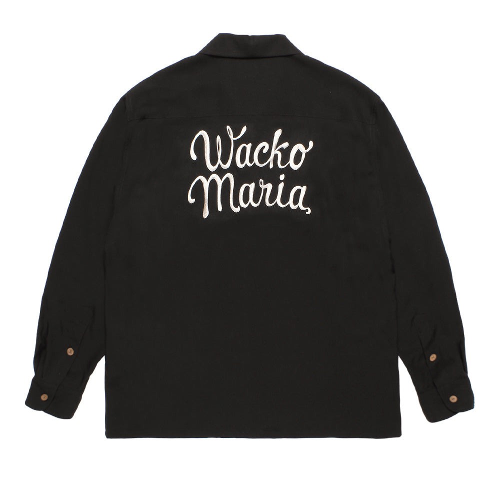 Back flat lay studio view of the Wacko Maria 50's Shirt Long Sleeve Type 5 in dark charcoal black, featuring an authentic 1950s rockabilly boxy silhouette with clean back shoulder yoke, straight hemline, double-button barrel cuffs, and prominent white chain-stitch cursive script embroidery reading "Wacko Maria" across the upper back.