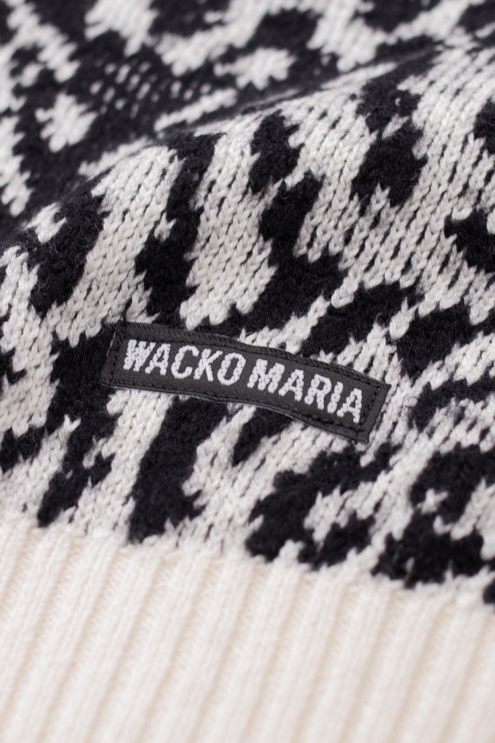 detailed leopard pattern texture on Wacko Maria jacquard sweater white, bold all over animal print on luxury Japanese knitwear