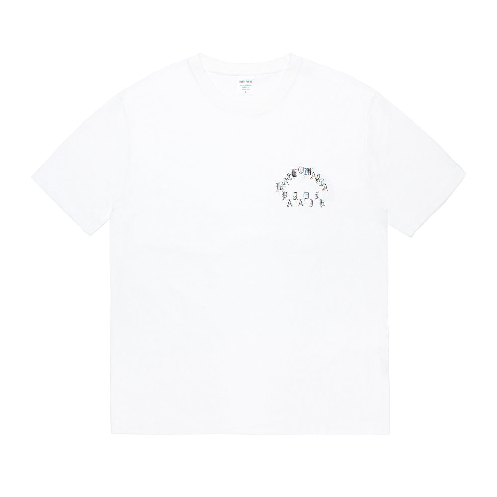 Front flat lay view of the white Wacko Maria Washed Heavyweight T-Shirt Type 2, highlighting the boxy cut, drop-shoulder short sleeves, ribbed neckline, and an arched black Old English screen-printed logo graphic reading "WACKO MARIA PARADISE" on the left chest.