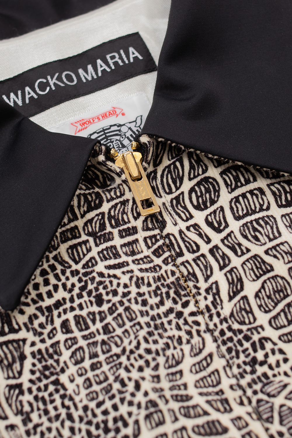 close up Wacko Maria Wolf’s Head jacket showing gold YKK zipper, signature collar construction and intricate printed chest panel, luxury Japanese streetwear jacket made in Japan