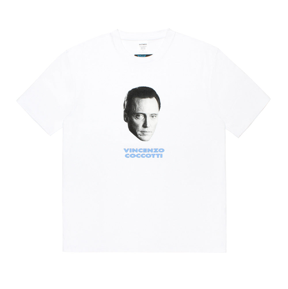 Front flat lay studio view of the Wacko Maria x True Romance Washed Heavy Weight Crew Neck T-Shirt Type 6 in clean white, featuring a relaxed boxy cut, ribbed crew neckline, and a centered front graphic print featuring Christopher Walken as Vincenzo Coccotti with light blue block typography underneath.