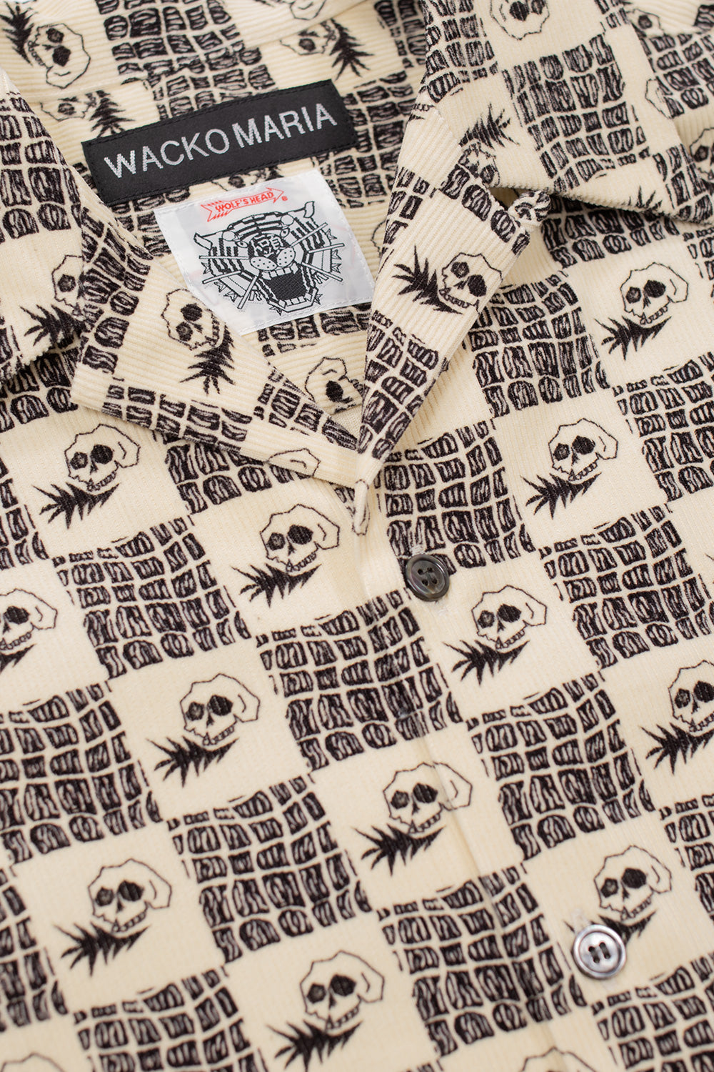 detailed collar shot of Wacko Maria Wolf’s Head collaboration shirt from Tokyo, featuring signature labels, skull motifs and vintage inspired print on textured corduroy cotton fabric